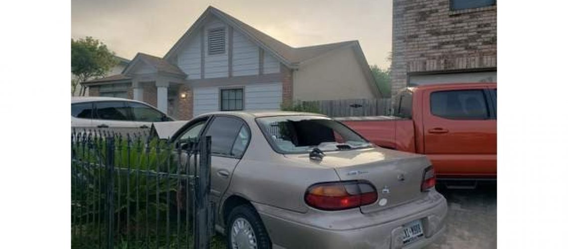 Daylight shows the damage done to a car by gunfire on Misty Plain Drive. (KSAT 12 News)